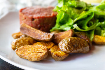 tasty Steak tartare (Raw beef) - classic steak tartare on white plate