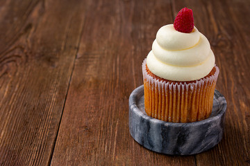 cake with cream and raspberry