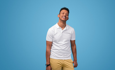 Cheerful African guy in polo shirt