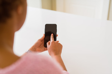 Close up of woman using blank screen of smartphone