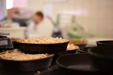 Freshly made delicious apple pies inside the kitchen of a local organic bakery in the Netherlands