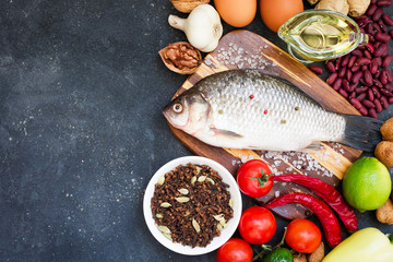 Healthy nutrition concept. Balanced healthy organic diet food. Fresh vegetables, fruit, beans, meat, fish, dairy products. Space for text. Top view. Cooking ingredients.  Clear eating. Copy space.