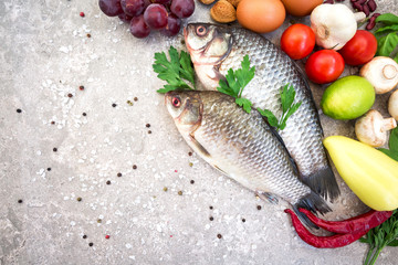 Healthy nutrition concept. Balanced healthy diet food background. Fresh organic vegetables, fruit, beans, fish. Space for text. Top view. Cooking ingredients. Copy space.