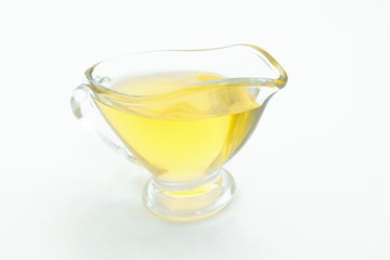 Bowl with olive oil isolated on white