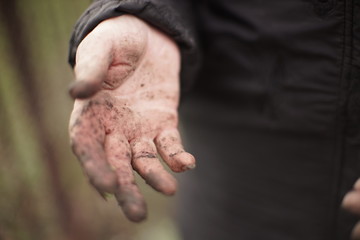 Dirty hand after garden work. Farmer without gloves