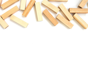 scattering of wooden bars in the upper part of the frame on a white isolated background with free space below