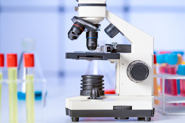 Test tubes and flasks and microscope in a chemical laboratory