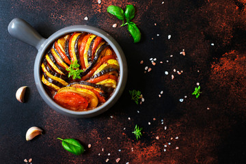 Ratatouille traditional french dish of baked summer vegetables served in a baking tray. Vegetarian...