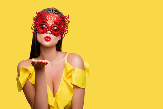 Air Kiss. Sexy girl makes a Kiss over his Hand. red lips. Happy luxury Model in beautiful Makeup on  yellow background. closed eyes for joy. Isolated. - Image  