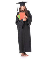 Full length portrait of young graduate girl student in mantle with colorful books. Teen girl isolated on white background