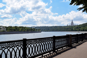Fototapeta na wymiar Moscow, Russia - July 8, 2019: The view of the Moskva river, Sparrow Hills and Moscow State University from the Vorobyevskaya embankment