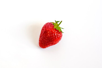 Whole fresh and juicy strawberries close up isolate