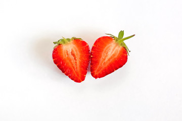 Strawberry berry cut in half close up isolate