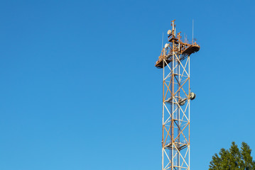 Fototapeta na wymiar Mobile and internet tower. Telecommunication sation. Gsm transmitter. Wifi internet signal tower. 