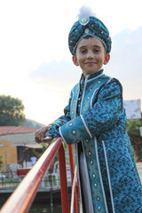 circumcision boy dressed in traditional clothing