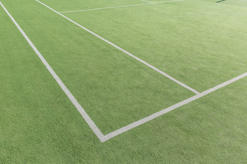 Obraz premium Part of the tennis court with markup. Artificial surface green sports field.