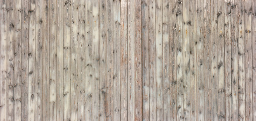 The texture of the wall made of wooden planks