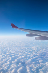 View from a plane window above the cloud.