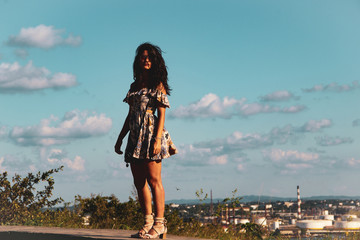girl looking at the clear blue sky 