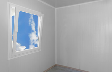 Modern window with clouds