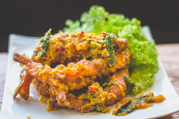 prawns stir fried in salted egg paste and basil and chilli