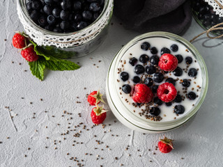 Milk yogurt with blueberries, raspberries, detox. Copy space.