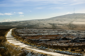 Frozen mountain road leading towards the transmitter mast on Kippure Mountain, Wicklow, Ireland