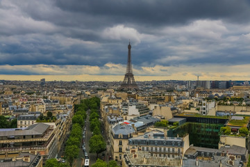 Panoramic aerial view of Paris with the famous and iconic Eiffel Tower in the centre and the Avenue d'Iéna leading to the Trocadéro on a cloudy day.