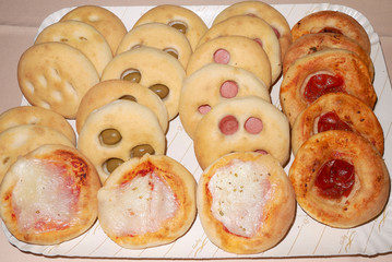 Assorted focaccia and pizza on a tray
