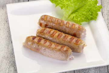 Grilled sausages served mushrooms and cabbage