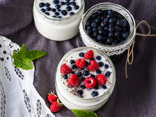 Milk yogurt with blueberries, raspberries, detox. Copy space.