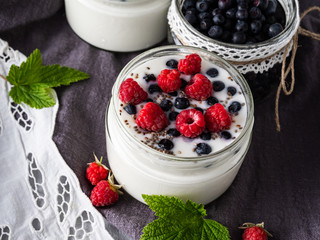 Milk yogurt with blueberries, raspberries, detox. Copy space.
