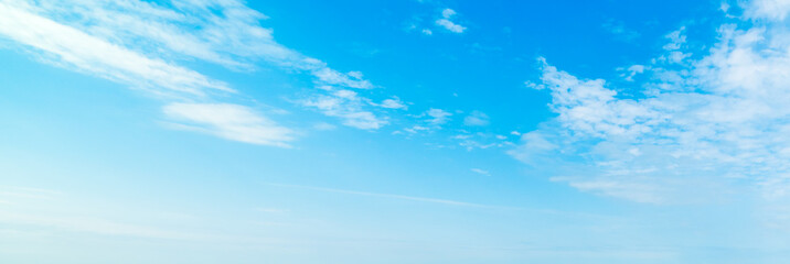 Naklejka na ściany i meble Blue sky with small clouds in summertime