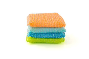 Sponge for cleaning cups, dishes and kitchen accessories. Blue, orange, yellow on a white background.