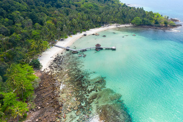Aerial view. Beautiful tropical beach and wooden bridge in the sea in island Koh Kood Thailand