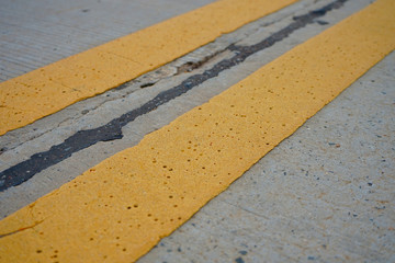 Yellow traffic color on concrete road