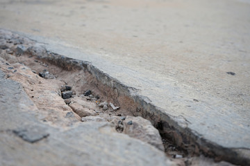 Concrete road cracks waiting for repairs