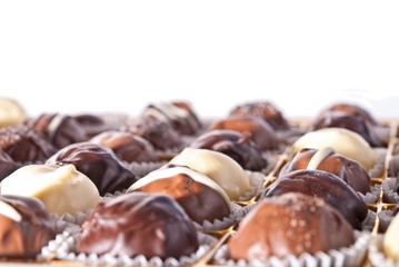 mixed white, brown and dark selfe made chocolate praline