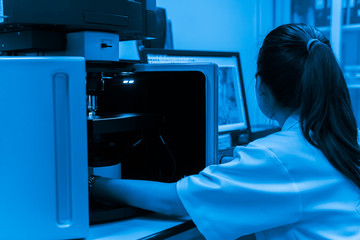 Asian scientist working in the lab,Experiment for customer,Using the formula, the physics and chemistry to calculate the value of the experiment,Thailand people