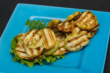 Grilled eggplant slices served basil