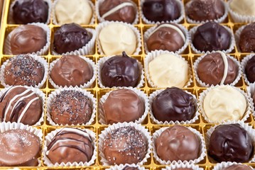 mixed white, brown and dark selfe made chocolate praline
