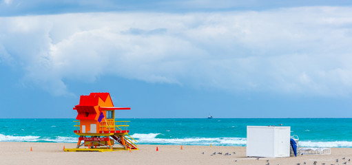 Red and orange lifeguard hut in Miami Beach
