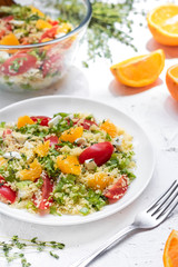 Healthy and simple food, light summer lunch, fragrant salad with couscous and oranges