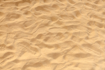 Fototapeta na wymiar Sand on the beach as background 