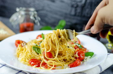 Fresh pasta with garlic Cherry Tomatoes and basil. Delicious Pasta Plate. Spaghetti. Italian food. Italy. Roma. Fine dining. Healthy food. Vegetarian. Healthy food