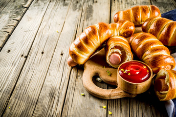 Pretzel wrapped hot dogs with sausages