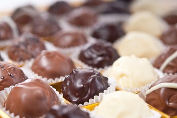 mixed white, brown and dark selfe made chocolate praline