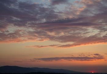 Fototapeta na wymiar Dramatic sunny hills under morning sky. Carpathian, Ukraine, 
