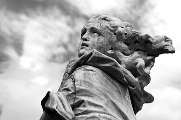 Statue of a woman in black and white.