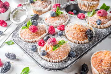 Muffins or cupcakes with berries